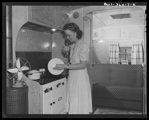 Middle River, Maryland. FSA (Farm Security Administration) project for Glenn L. Martin aircraft workers. Mrs. George Davis preparing dinner in her trailer home