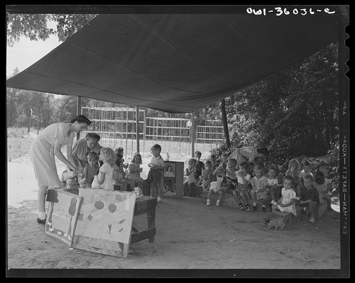 Untitled photo, possibly related to: Middle River, a small crossroads in the vicinity of Baltimore, Maryland. FSA (Farm Security Administration) housing project (later administered by the National Housing Agency) for Glenn L. Martin aircraft workers. Daily Bible class conducted for the children at t