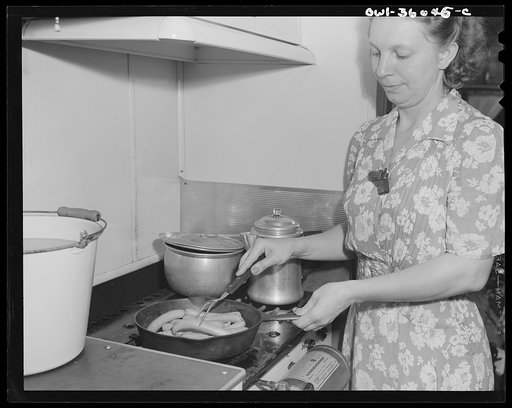 Middle River, a small crossroads in the vicinity of Baltimore, Maryland. FSA (Farm Security Administration) housing project (later administered by the National Housing Agency) for Glenn L. Martin aircraft workers. Mrs. Emma D. Gaw, assistant project service advisor, preparing dinner in her trailer h