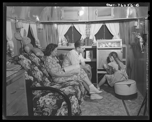 Untitled photo, possibly related to: Middle River, Maryland. FSA (Farm Security Administration) housing project for Glenn L. Martin aircraft workers. Mrs. Emma D. Gaw, assistant project service advisor, with her daughter and husband who works in the Glenn L. Martin plant, relaxing in their trailer h