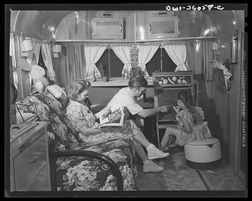 Middle River, Maryland. FSA (Farm Security Administration) housing project for Glenn L. Martin aircraft workers. Mrs. Emma D. Gaw, assistant project service advisor, with her daughter and husband who works in the Glenn L. Martin plant, relaxing in their trailer home