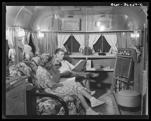 Untitled photo, possibly related to: Middle River, Maryland. FSA (Farm Security Administration) housing project for Glenn L. Martin aircraft workers. Mrs. Emma D. Gaw, assistant project service advisor, with her daughter and husband who works in the Glenn L. Martin plant, relaxing in their trailer h
