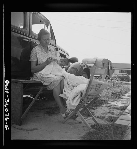 Untitled photo, possibly related to: Middle River, Maryland. FSA (Farm Security Administration) housing project for the Glen L. Martin aircraft workers. Woman crocheting