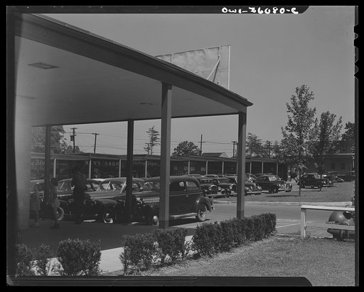 Middle River, a small crossroads in the vicinity of Baltimore, Maryland. FSA (Farm Security Administration) housing project (later administered by the National Housing Agency) for Glenn L. Martin Aircraft Plant workers. Cars parked in the shopping center