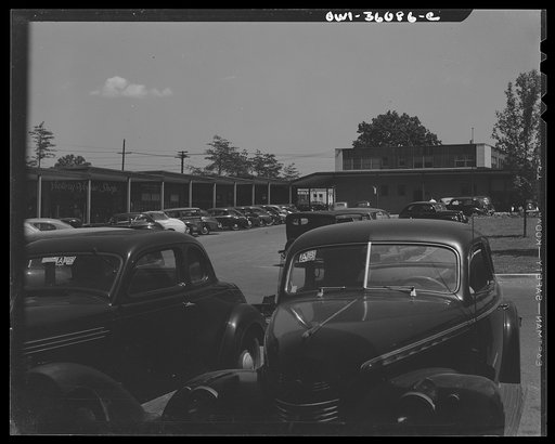 Middle River, a small crossroads in the vicinity of Baltimore, Maryland. FSA (Farm Security Administration) housing project (later National Housing Agency) for Glenn L. Martin aircraft plant workers. Cars parked in shopping center