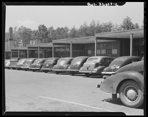 Middle River, a small crossroads in the vicinity of Baltimore, Maryland.  FSA (Farm Security Administration) housing project (later National Housing Agency) for Glenn L. Martin aircraft plant workers. Cars parked in shopping center