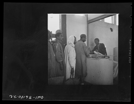 Mejex-El-Bab, Tunisia. A market operated by the Allied civilian relief groups to sell at cost food, clothing, kerosene, etc., supplied by the U.S. Office of Foreign Relief and Rehabilitation Operations to natives and Europeans, victims of war deprivation