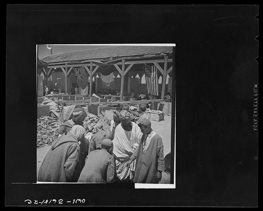 Mejex-El-Bab, Tunisia. A market operated by the Allied civilian relief groups to sell at cost food, clothing, kerosene, etc., supplied by the U.S. Office of Foreign Relief and Rehabilitation Operations to natives and Europeans, victims of war deprivation