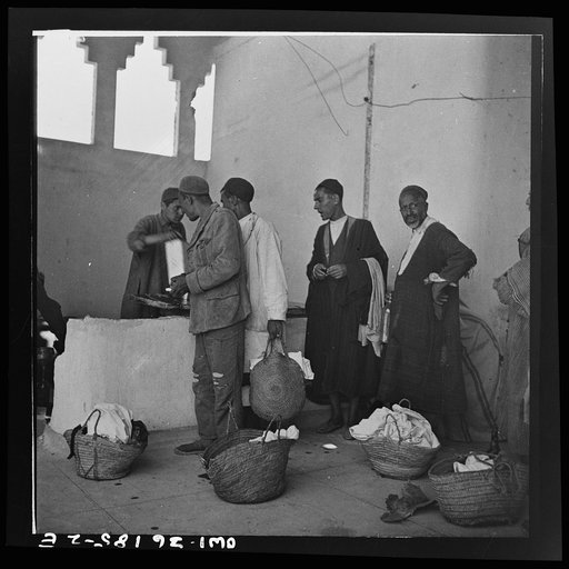 Mejex-El-Bab, Tunisia. A market operated by the Allied civilian relief groups to sell at cost food, clothing, kerosene, etc., supplied by the U.S. Office of Foreign Relief and Rehabilitation Operations to natives and Europeans, victims of war deprivation