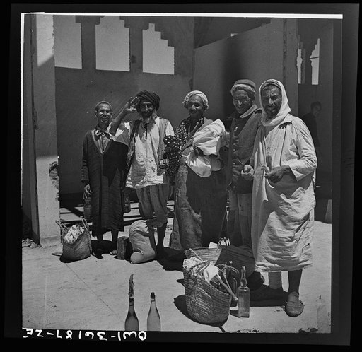 Mejex-El-Bab, Tunisia. A market operated by the Allied civilian relief groups to sell at cost food, clothing, kerosene, etc., supplied by the U.S. Office of Foreign Relief and Rehabilitation Operations to natives and Europeans, victims of war deprivation