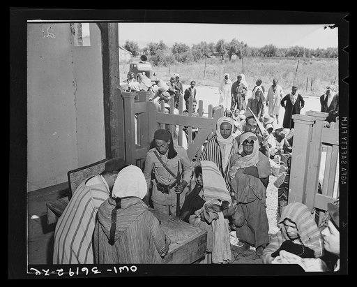 Mejex-El-Bab, Tunisia. A market operated by the Allied civilian relief groups to sell at cost food, clothing, kerosene, etc., supplied by the U.S. Office of Foreign Relief and Rehabilitation Operations to natives and Europeans, victims of war deprivation
