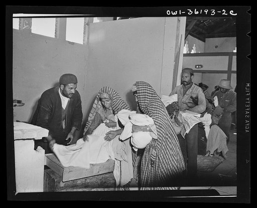 Mejex-El-Bab, Tunisia. A market operated by the Allied civilian relief groups to sell at cost food, clothing, kerosene, etc., supplied by the U.S. Office of Foreign Relief and Rehabilitation Operations to natives and Europeans, victims of war deprivation