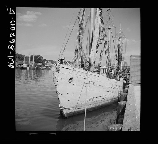 Gloucester, Massachusetts - Heavy nets slide down Old Glory's side at fishing grounds off the New England coast where rosefish are being sought. This species of fish can be caught only in daytime