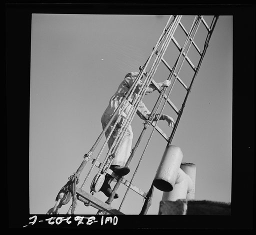 Gloucester, Massachusetts. A lookout climbs the cables high above Old Glory's deck to check the location of other tralers. When one trawler strikes good fishing ground the captain notifies other boats in the fleet