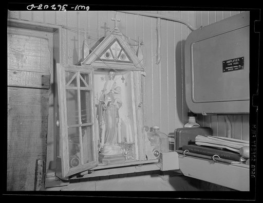 Gloucester, Massachusetts. The "Mother of Good Voyages" statue in Captain John Riberia's [i.e., Ribeiro's] quarters on the fishing trawler "Old Glory"