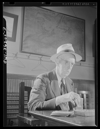 Gloucester, Massachusetts. Playing cribbage in the Master Mariner's Association, whose members have been captains on fishing vessels
