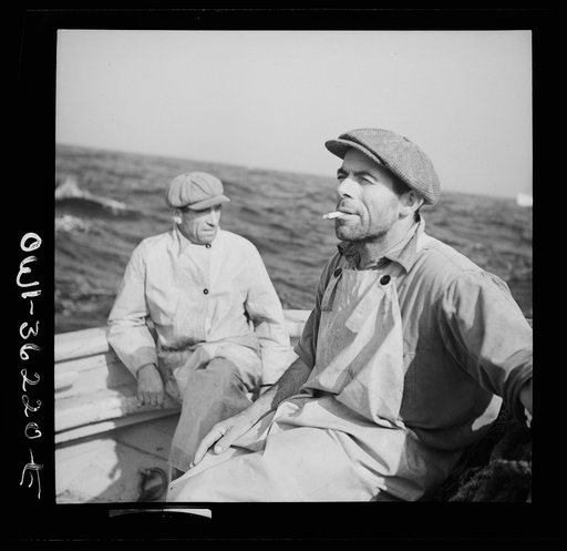 On board a line trawler converted for dragging, fishing out from Gloucester, Massachusetts. Taking it easy