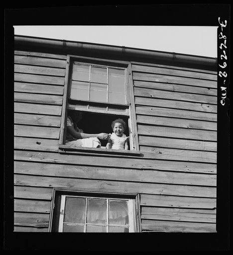 Washington, D.C. A child in her home, which is an alley dwelling near the capitol