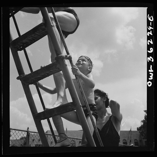 Glen Echo, Maryland. Climbing the ladder to the sliding board at the Glen Echo swimming pool