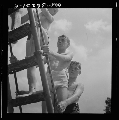 Glen Echo, Maryland. Climbing the ladder to the sliding board at the Glen Echo swimming pool