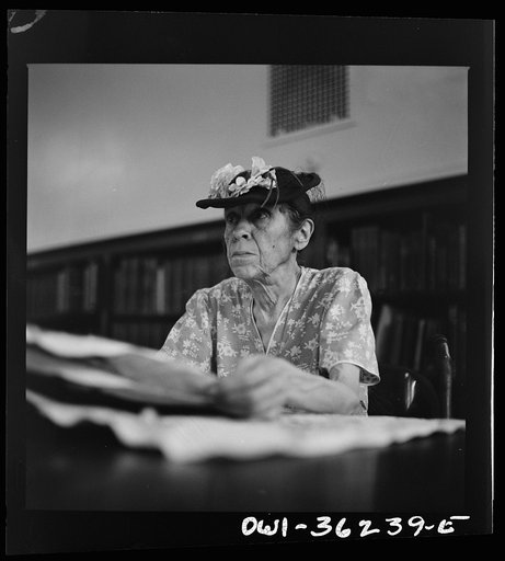 Untitled photo, possibly related to: Washington, D.C. A woman in the reading room of a public library