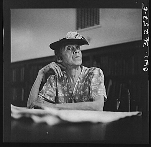 Untitled photo, possibly related to: Washington, D.C. A woman in the reading room of a public library