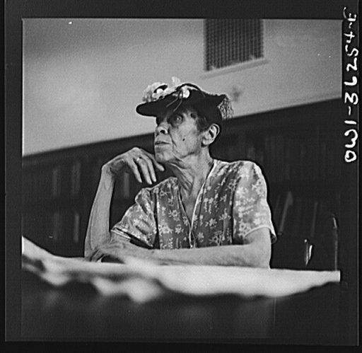 Untitled photo, possibly related to: Washington, D.C. A woman in the reading room of a public library