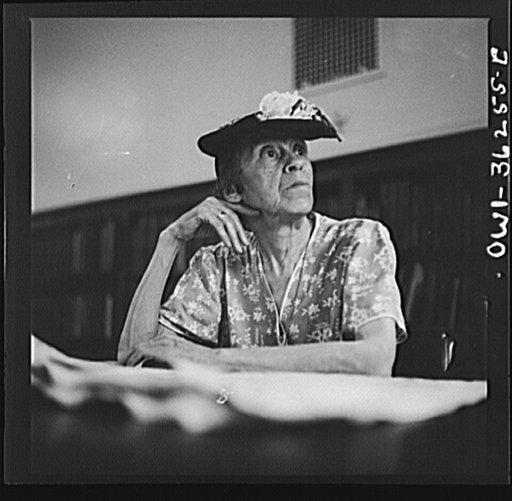 Untitled photo, possibly related to: Washington, D.C. A woman in the reading room of a public library