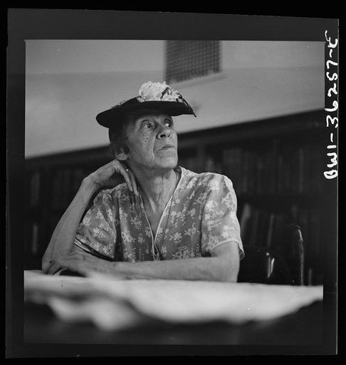 Untitled photo, possibly related to: Washington, D.C. A woman in the reading room of a public library