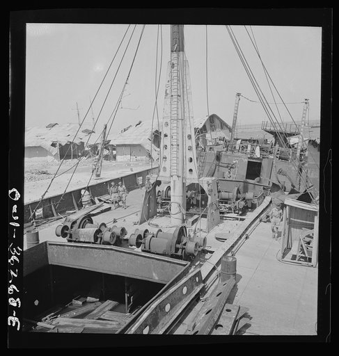 Tunis, Tunisia. American soldiers inspecting wrecked ships in Tunis harbor