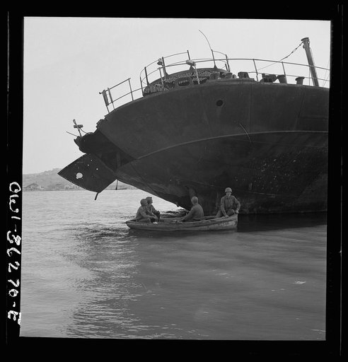 Tunis, Tunisia. American soldiers inspecting wrecked ships in Tunis harbor