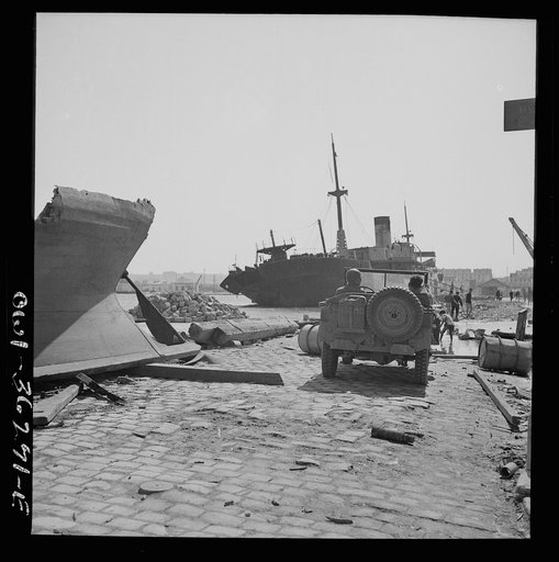 Tunis, Tunisia. American soldiers inspecting wrecked ships in Tunis harbor