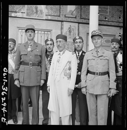 Carthage, Tunisia. General de Gaulle, the Bey of Tunis and General Mast in the courtyard of the bey's summer palace