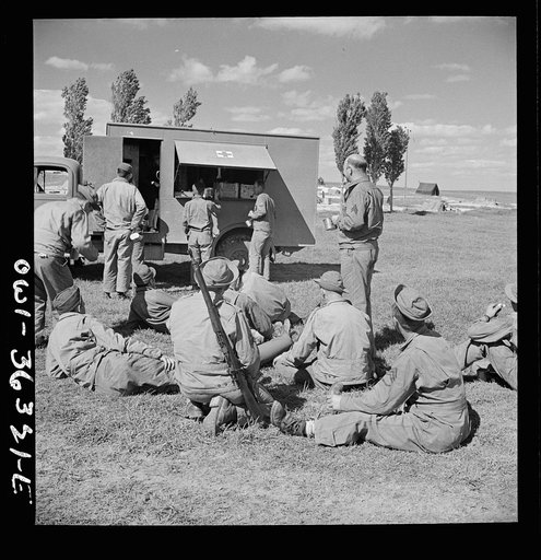 Untitled photo, possibly related to: Constantine (vicinity), Algeria. Red Cross clubmobile serving refreshments to an anti-aircraft gun crew stationed in an outlying post