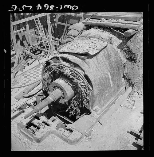 Untitled photo, possibly related to: La Goulette, Tunisia. Wrecked turbine which formerly provided electric power for the entire Tunis area. Only one of the turbines is still running