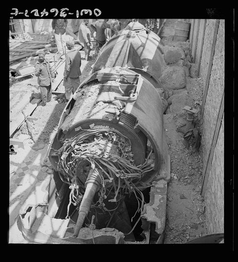 Untitled photo, possibly related to: La Goulette, Tunisia. Wrecked turbine which formerly provided electric power for the entire Tunis area. Only one of the turbines is still running