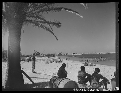 Untitled photo, possibly related to: Bizerte, Tunisia. American troops bathing on the beach after tha Allied victory