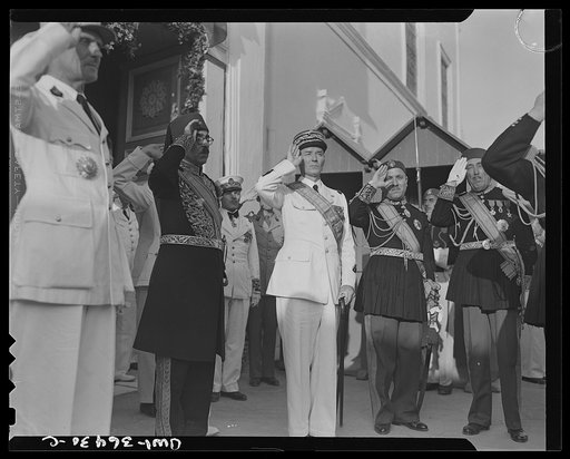 Untitled photo, possibly related to: Carthage, Tunisia. General de Gaulle, the Bey of Tunis and General Mast in the courtyard of the bey's summer palace