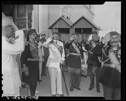 Untitled photo, possibly related to: Carthage, Tunisia. General de Gaulle, the Bey of Tunis and General Mast in the courtyard of the bey's summer palace