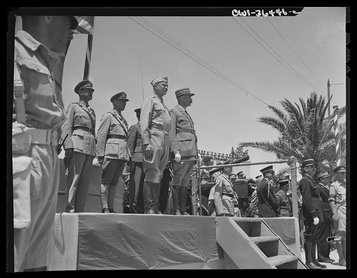 Untitled photo, possibly related to: Tunis, Tunisia. American soldiers passing the stand in the Allied victory parade along Avenue Gambetta