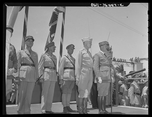 Untitled photo, possibly related to: Tunis, Tunisia. American soldiers passing the stand in the Allied victory parade along Avenue Gambetta