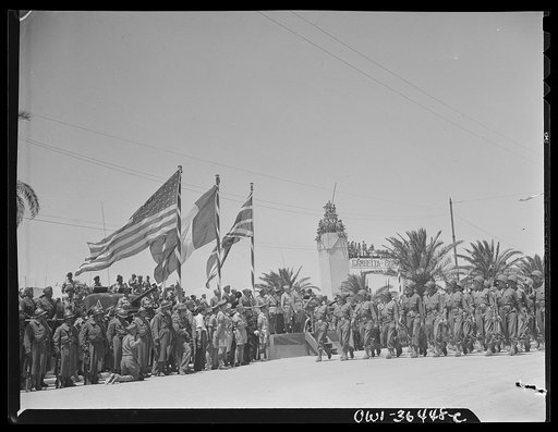Tunis, Tunisia. American soldiers passing the stand in the Allied victory parade along Avenue Gambetta