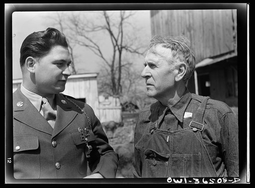 Rockville (vicinity), Maryland. Private Harvey Horton, visiting the N.C. Stiles dairy farm while on furlough from Fort Belvoir, Virginia, talking with Mr. Stiles
