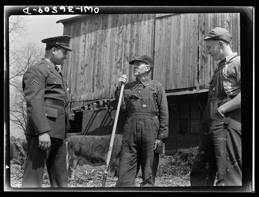 Rockville (vicinity), Maryland. Private Harvey Horton, visiting the N.C. Stiles dairy farm while on furlough from Fort Belvoir, Virginia, talking with Mr. Stiles and sixteen-year-old Charles Stiles