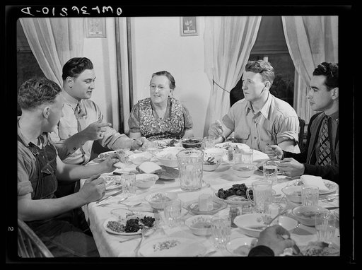 Rockville (vicinity), Maryland. Private Harvey Horton, visiting the N.C. Stiles dairy farm while on furlough from Fort Belvoir, Virginia, at lunch with the family