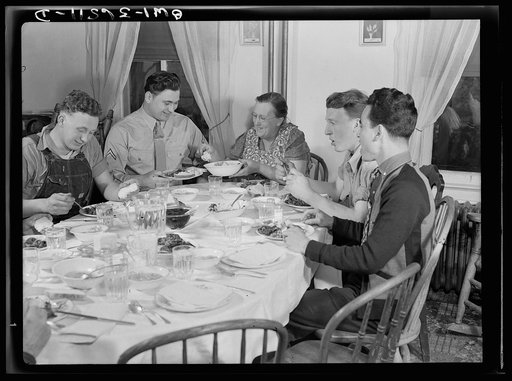 Rockville (vicinity), Maryland. Private Harvey Horton, visiting the N.C. Stiles dairy farm while on furlough from Fort Belvoir, Virginia, at lunch with the family
