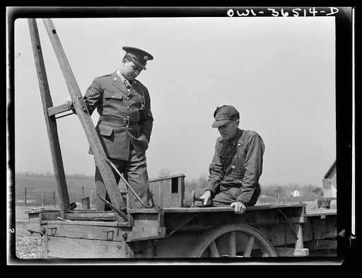 Rockville (vicinity), Maryland. Private Harvey Horton, visiting the N.C. Stiles dairy farm while on furlough from Fort Belvoir, Virginia, with Mr. Stiles