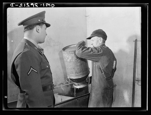 Rockville (vicinity), Maryland. Private Harvey Horton, visiting the N.C. Stiles dairy farm while on furlough from Fort Belvoir, Virginia, talking with Mr. Stiles