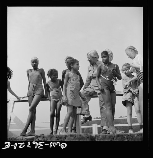 Haverstraw, New York. Interracial activities at Camp Christmas Seals, where children are aided by the Methodist Camp Service. Mrs. Addie C. Cox, director, giving instruction to the campers before the swim