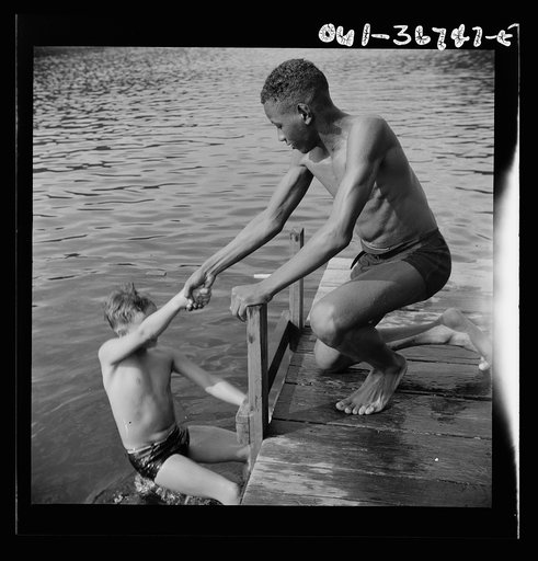 Untitled photo, possibly related to: Southfields, New York. Interracial activities at Camp Nathan Hale, where children are aided by the Methodist Camp Service. A scene at the swimming dock